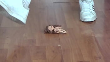 woman 170 cm, 75 kg steps on a small doll